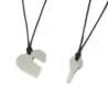Double heart necklace with key in 925 silver on a string Double heart necklace with key in 925 silver on a string