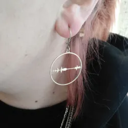 Silver platinum plated earrings with cut waveform