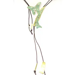 Handmade butterfly-shaped brass necklace with green patina on brown cord