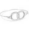 Silver platinum plated handcuff bracelet with ringed IDs