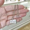 Silver platinum plated rectangle pendant with engraving of a children's painting, stainless steel chain
