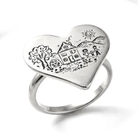 Silver ring with engraving of a children's drawing on a heart