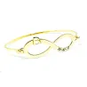 Bangle bracelet with infinity, monogram and date on sterling silver gold plated Bangle bracelet with infinity, monogram and date on sterling silver gold plated