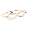 Bangle bracelet with infinity, monogram and date on sterling silver gold plated Bangle bracelet with infinity, monogram and date on sterling silver gold plated