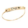 Bangle bracelet with your pet name and pawprint engraved in sterling silver gold plated Bangle bracelet with your pet name and pawprint engraved in sterling silver gold plated