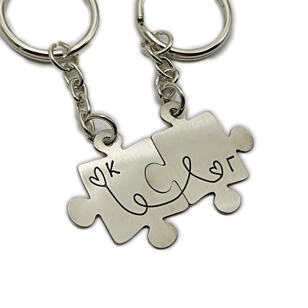 Double puzzle keychain with monograms made of nickel silver with stainless steel ring