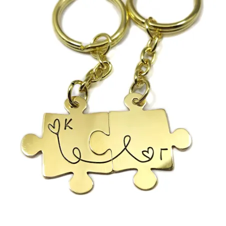 Double puzzle keychain with monograms made of brass with stainless steel ring