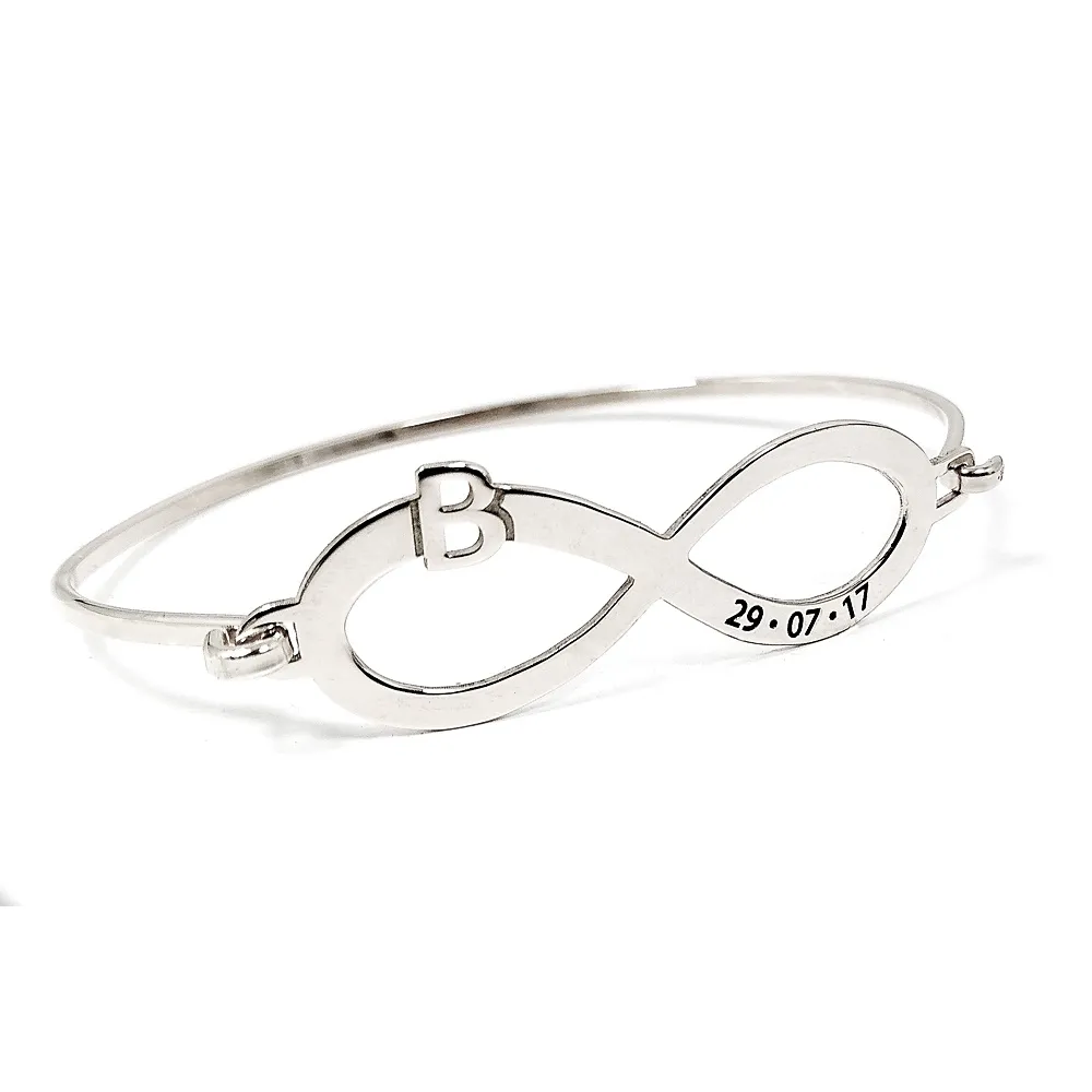 Bangle bracelet with infinity, monogram and date on platinum silver Bangle bracelet with infinity, monogram and date on platinum silver