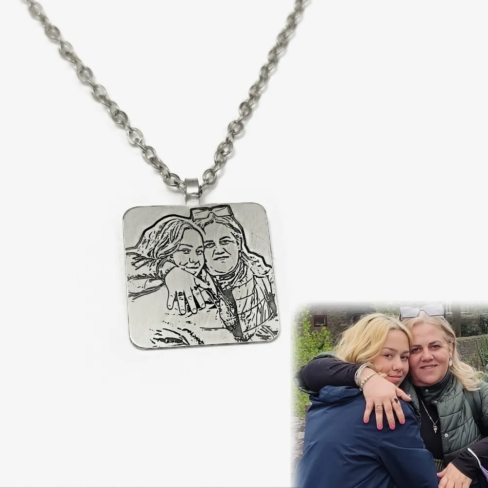 Nickel silver pendant with engraved photo + date on the back side Nickel silver pendant with engraved photo + date on the back side