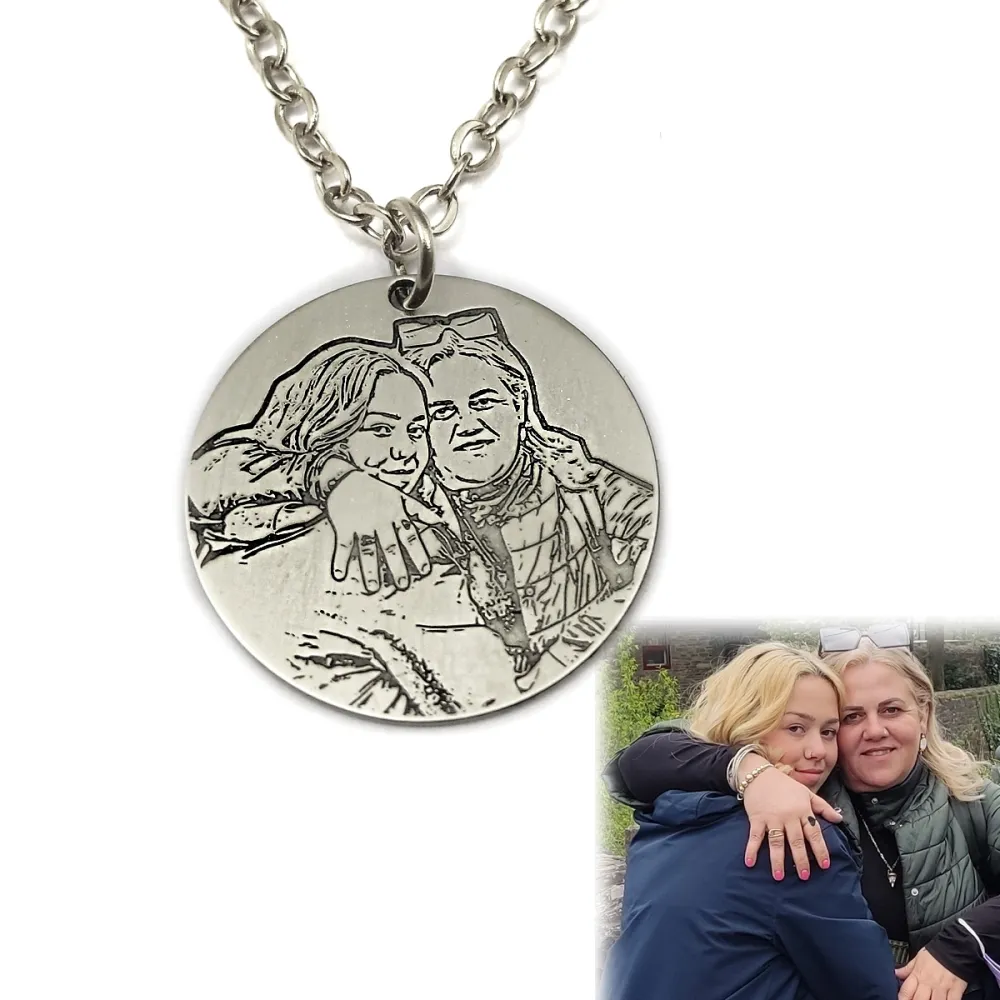 Nickel silver pendant with engraved photo + date on the back side Nickel silver pendant with engraved photo + date on the back side