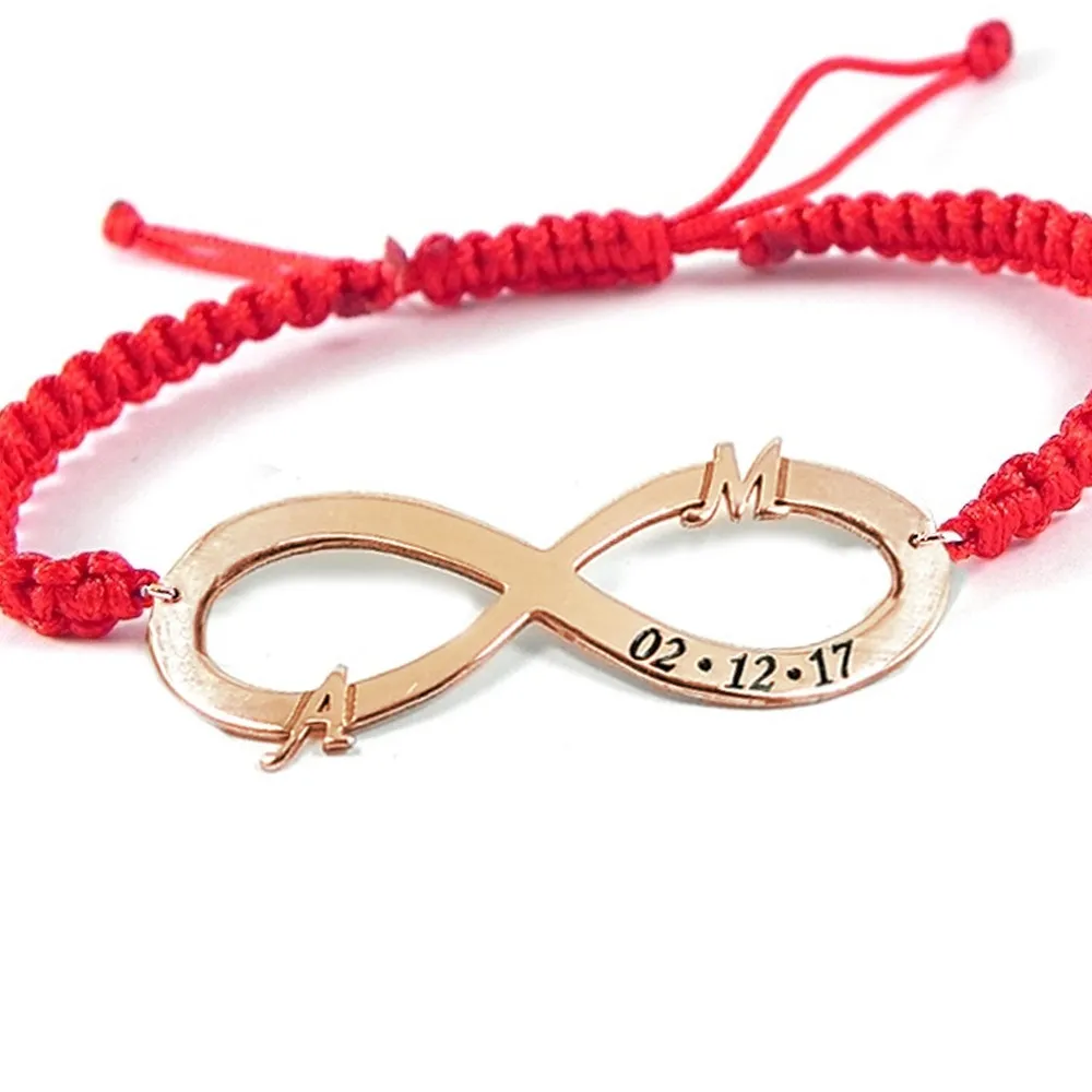 Silver rose gold plated infinity bracelet with monograms and date and red macrame cord Silver rose gold plated infinity bracelet with monograms and date and red macrame cord