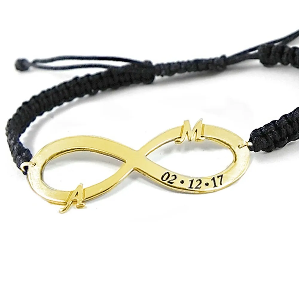 Silver gold plated infinity bracelet with monograms and date and black macrame cord Silver gold plated infinity bracelet with monograms and date and black macrame cord