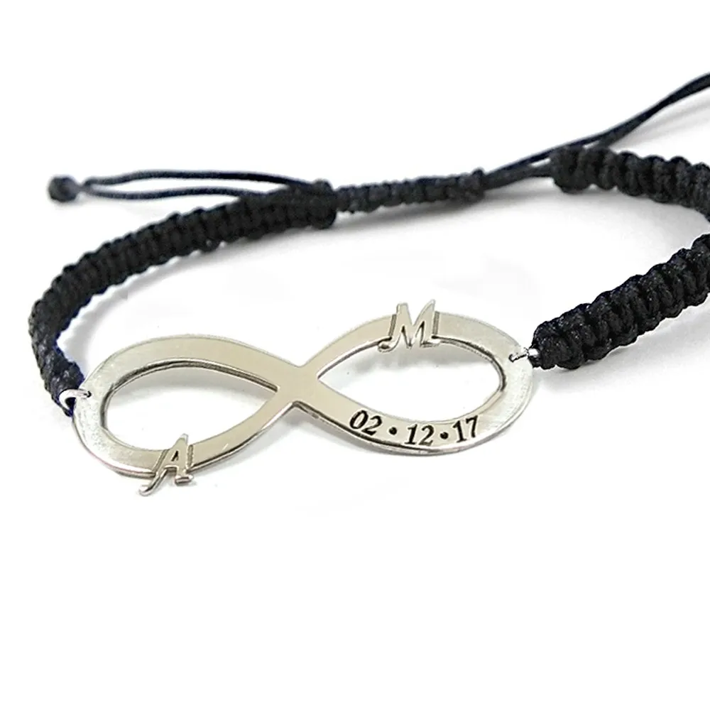 Silver platinum plated infinity bracelet with monograms and date and black macrame cord Silver platinum plated infinity bracelet with monograms and date and black macrame cord