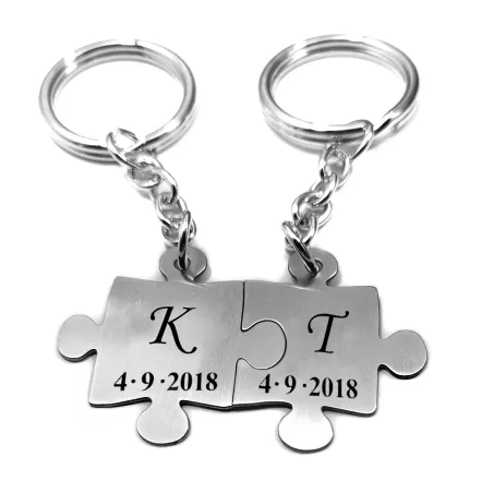 Double keyring with nickel silver puzzle pieces with monograms and date