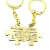 Double keyring with brass puzzle pieces with names and date