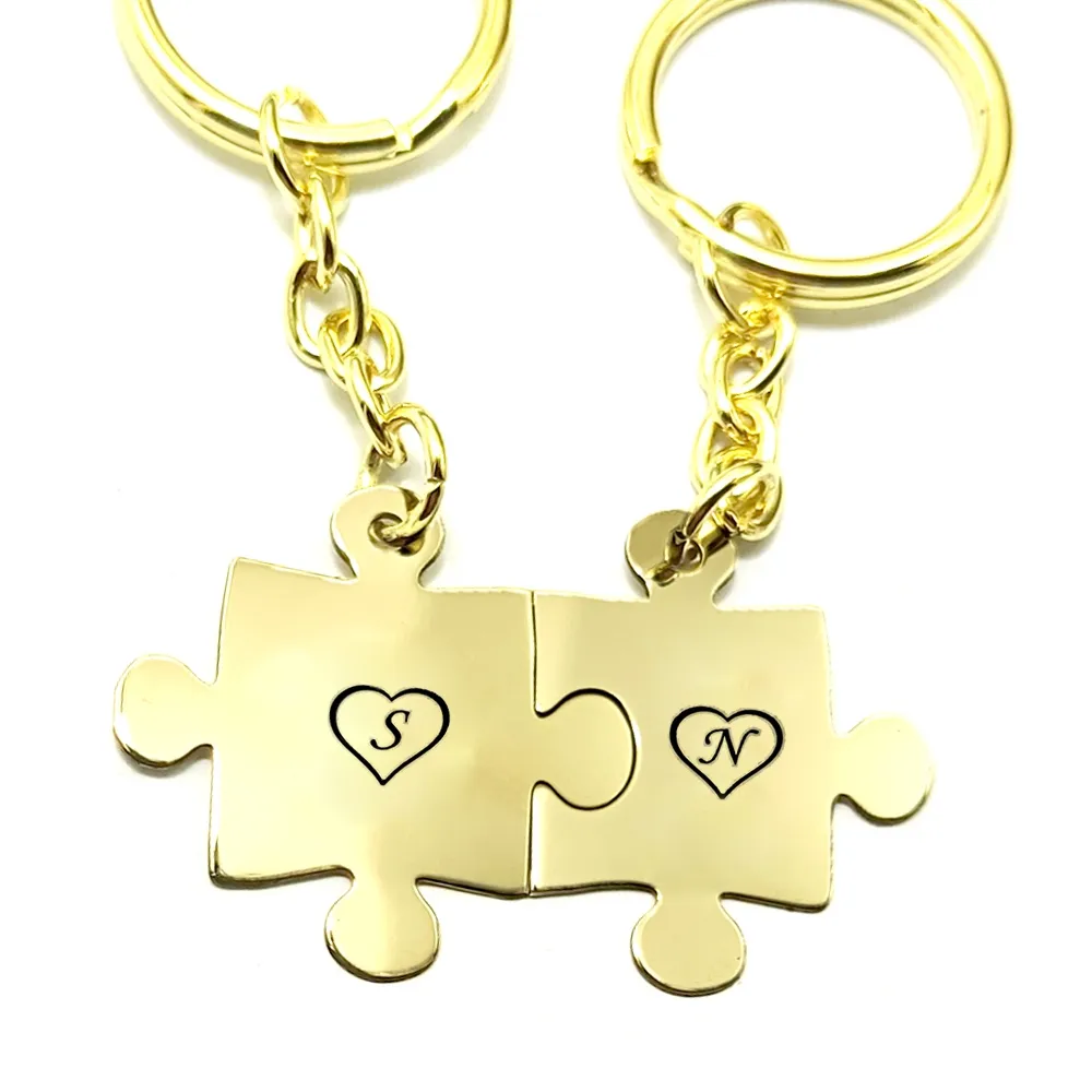 Double keyring with brass puzzle pieces with monograms