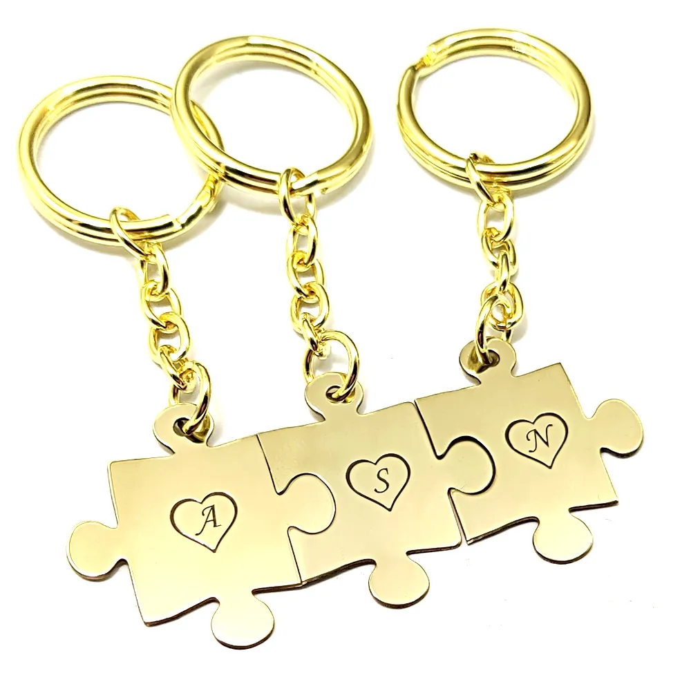Triple keyring with brass puzzle pieces with monograms