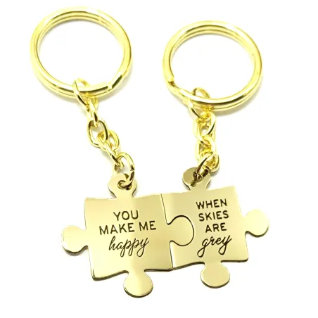 Double keyring with brass puzzle pieces "You make me happy..."