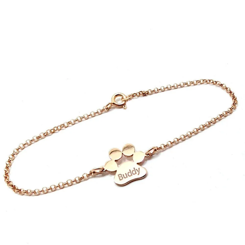 Sterling silver platinum plated dog-cat paw bracelet with engraved name of your favorite pet Sterling silver platinum plated dog-cat paw bracelet with engraved name of your favorite pet