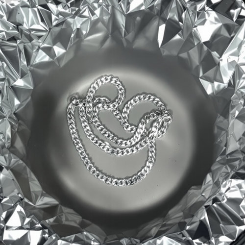 Sterling silver necklace in aluminum foil and baking soda bath