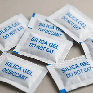 a few silica gel sachets, like the ones you find inside shoe or electronics boxes.